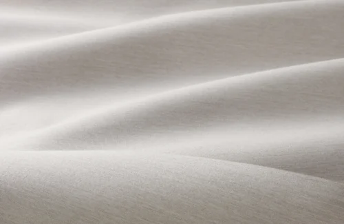 Nahaufnahme von weicher, beiger Stoffstruktur